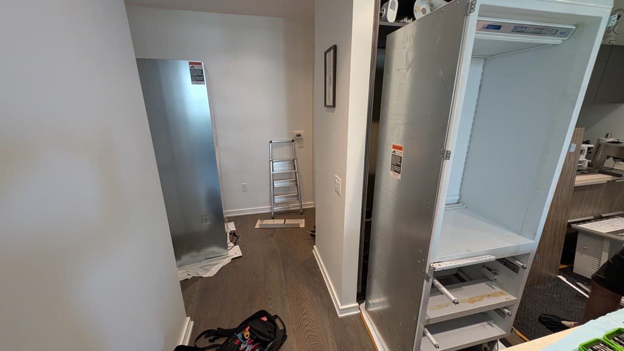 Appliance Installation Vancouver removing old fridge and preparing new refrigerator for installation