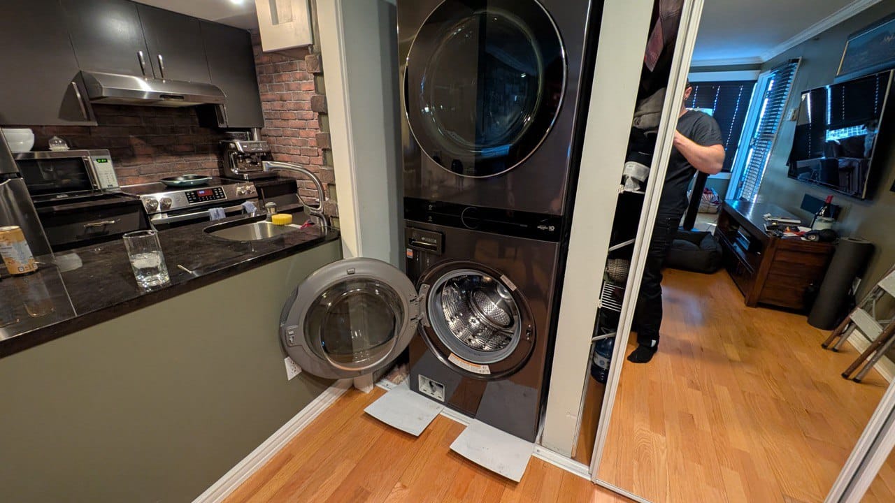 Appliance Installation Vancouver technician installing washer and dryer in a home laundry space