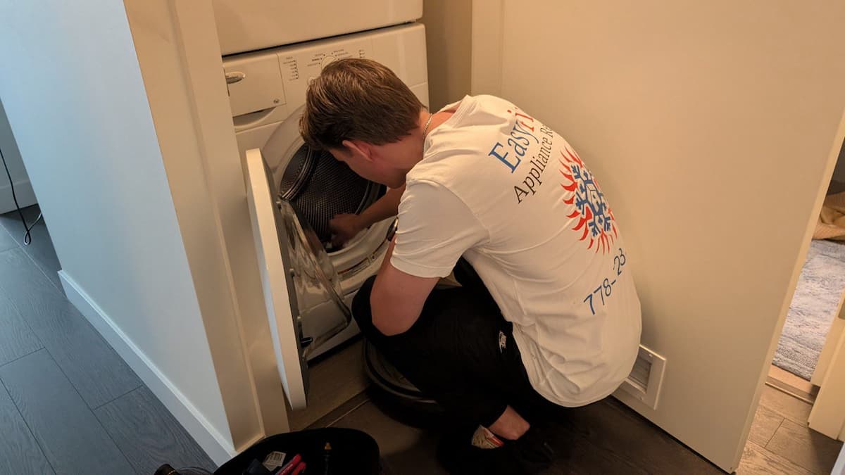 Easy Fix technician repairing Whirlpool washer drum in Vancouver home