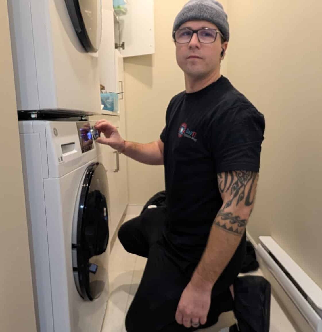 Appliance Repair Coquitlam technician fixing GE washer in Coquitlam home