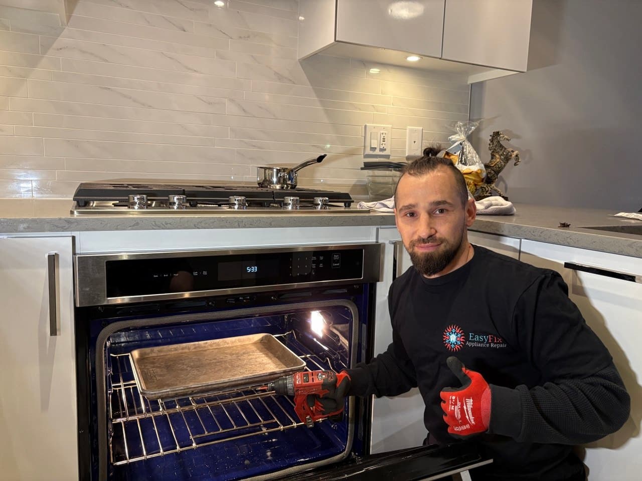 EasyFix technician repairing a luxury appliance in West Vancouver